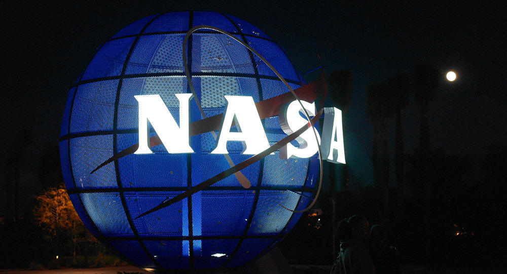 Blue Globe statue with glowing NASA logo
